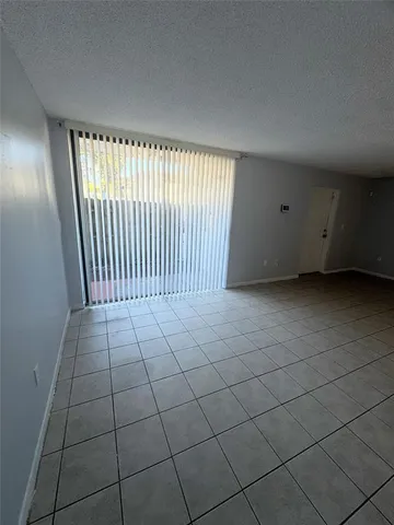a kitchen with a stove a sink and a refrigerator