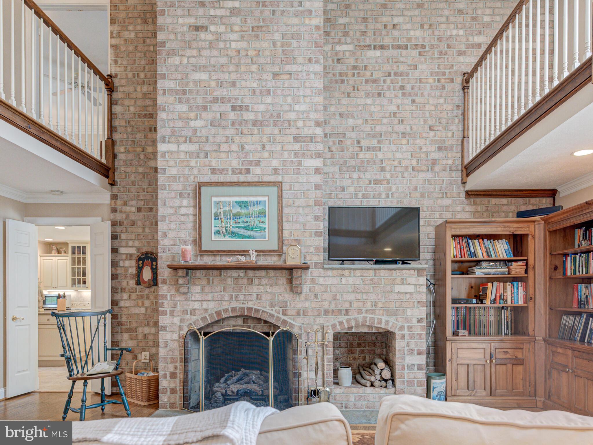 16325 Whitehaven Road Silver Spring, MD 20906 - Photo 15 of 55 Gas Fireplace with Classic Brick Surround