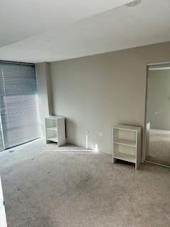 800 Elgin Road, Unit 1404 Evanston, IL 60201 - Photo 5 of 8 a view of an empty room with a window