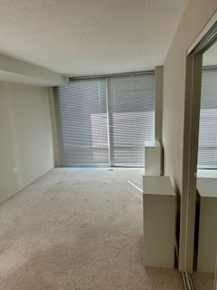 800 Elgin Road, Unit 1404 Evanston, IL 60201 - Photo 6 of 8 a view of an empty room with a fireplace