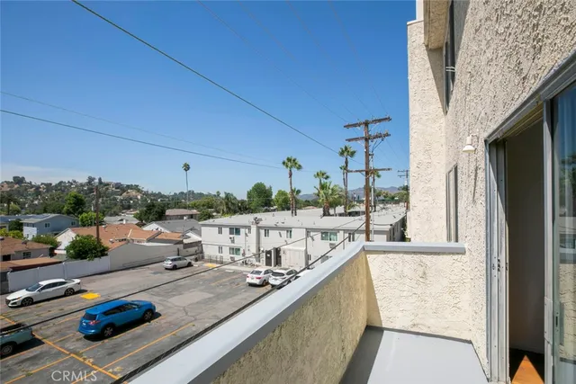 a view of swimming pool from a balcony