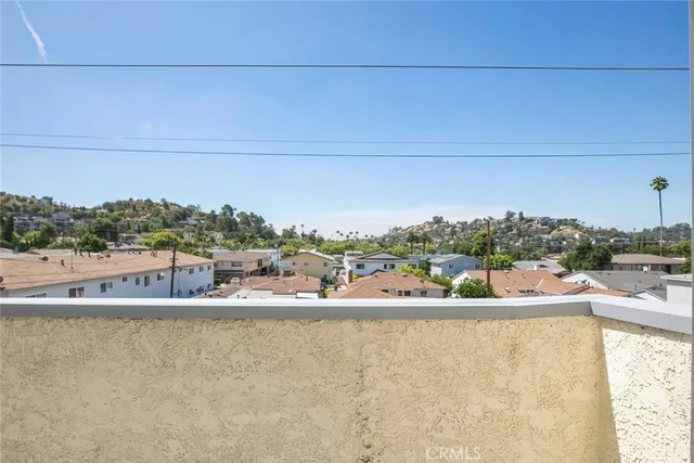a view of a swimming pool and a yard
