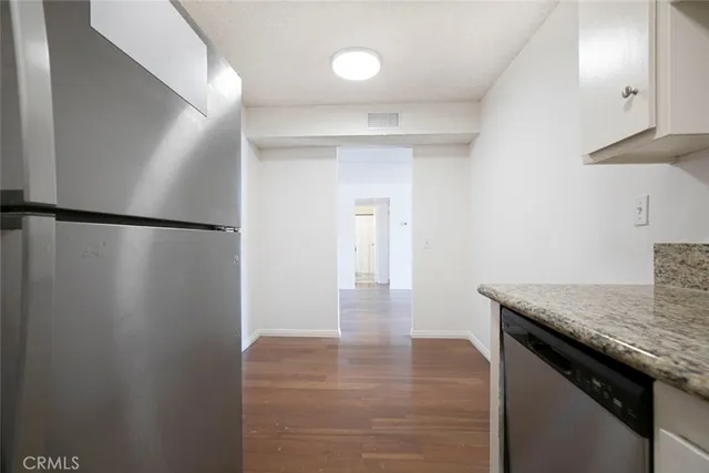 a view of kitchen island with wooden floor