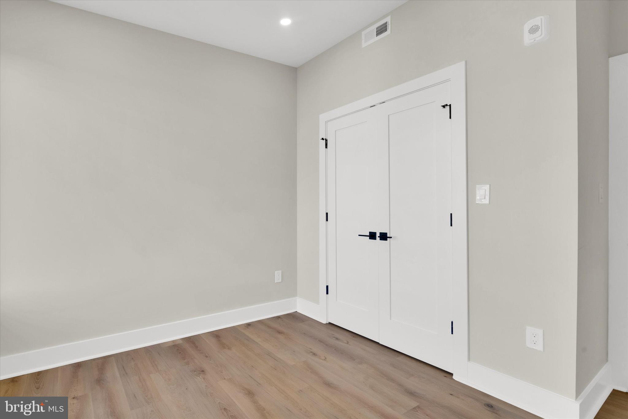 1915 Benning Road Northeast, Unit 2 Washington, DC 20002 - Photo 14 of 17 a view of an empty room with wooden floor