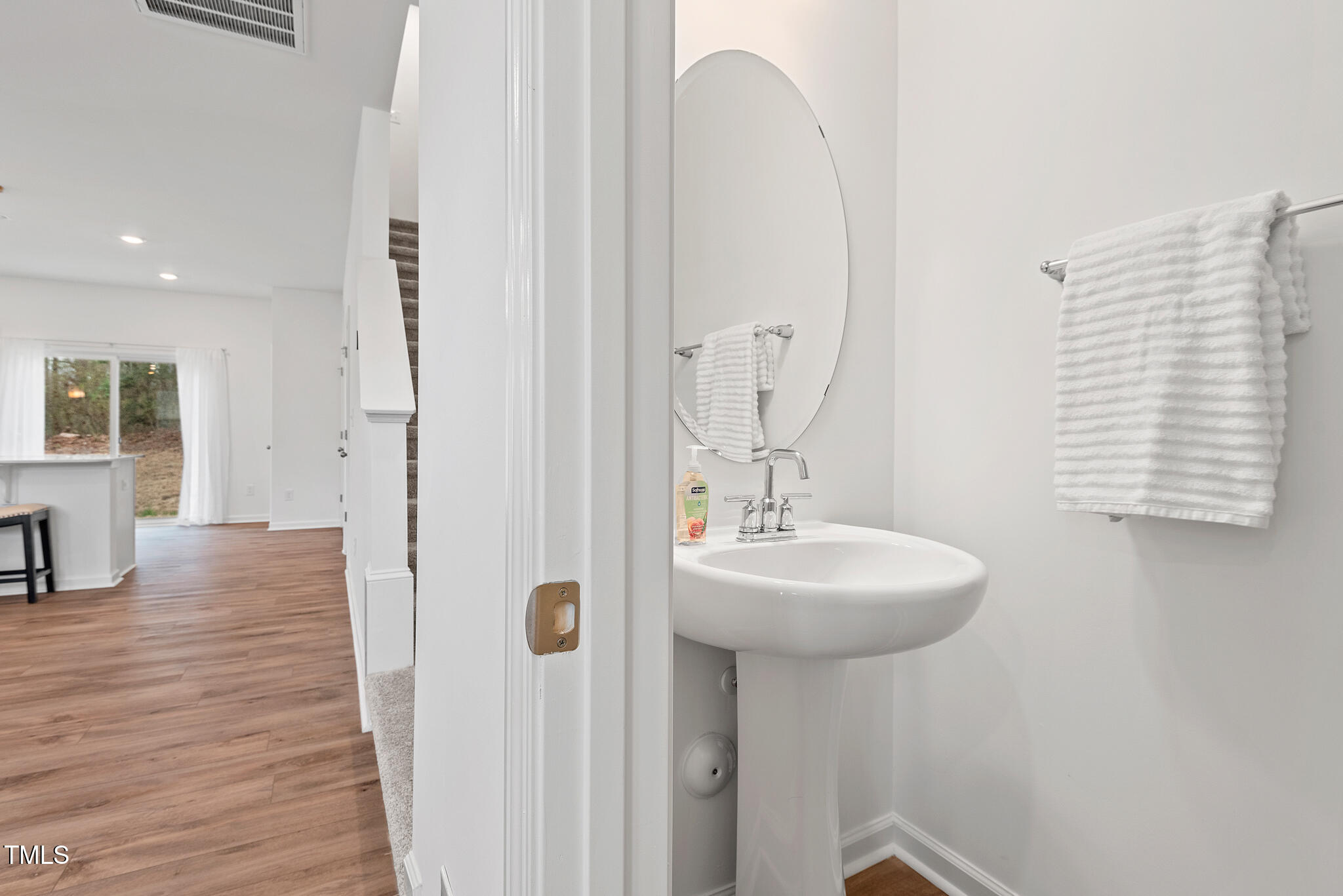 3028 Spline Circle Raleigh, NC 27610 - Photo 11 of 27 a bathroom with a sink a mirror and shower