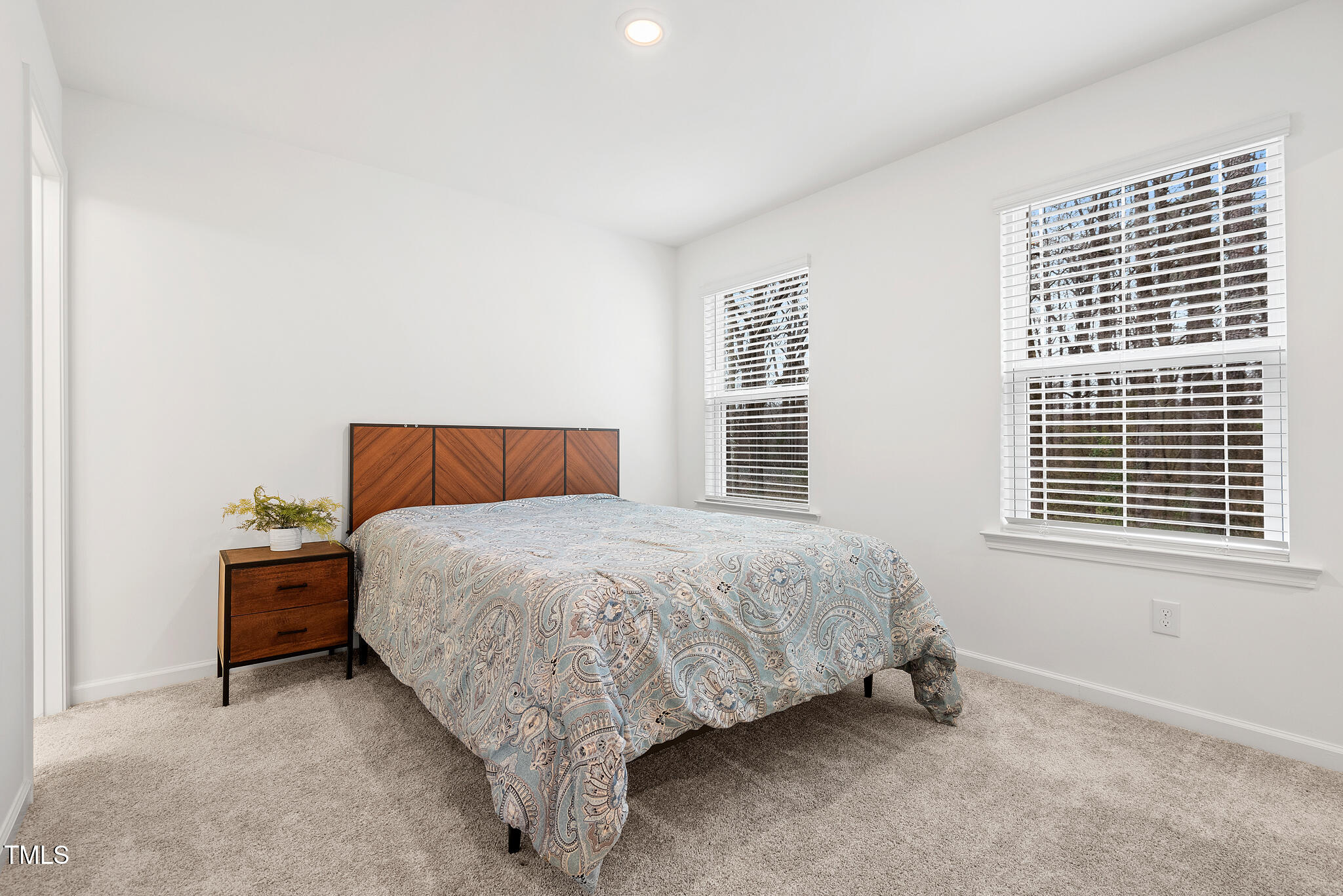 3028 Spline Circle Raleigh, NC 27610 - Photo 12 of 27 a bedroom with a bed and a window