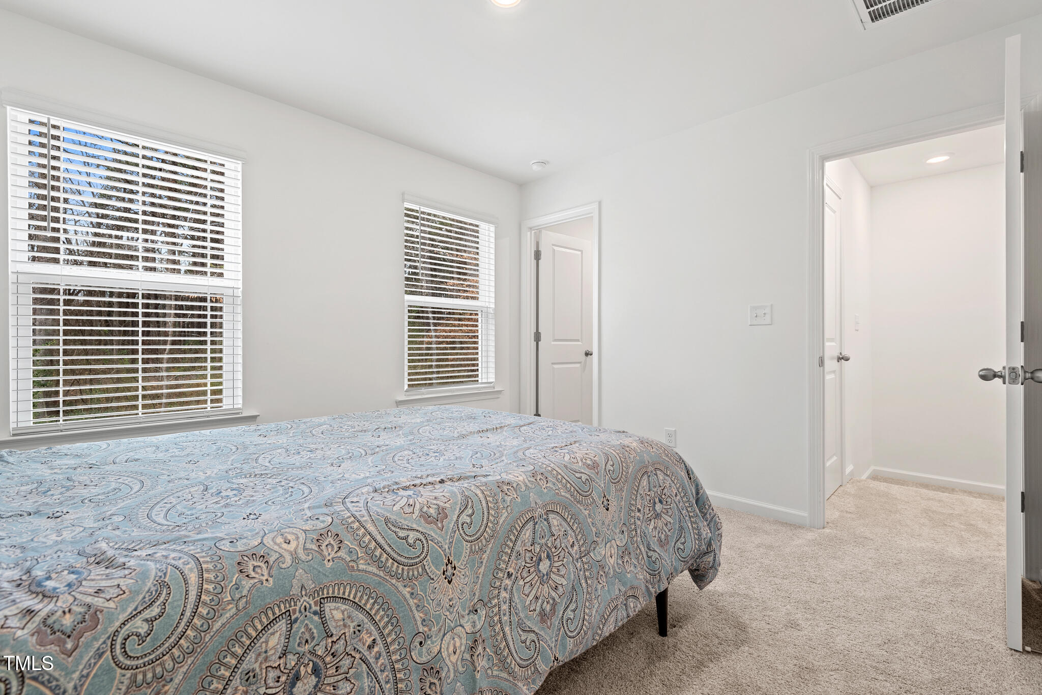 3028 Spline Circle Raleigh, NC 27610 - Photo 14 of 27 a bedroom with a bed and a window