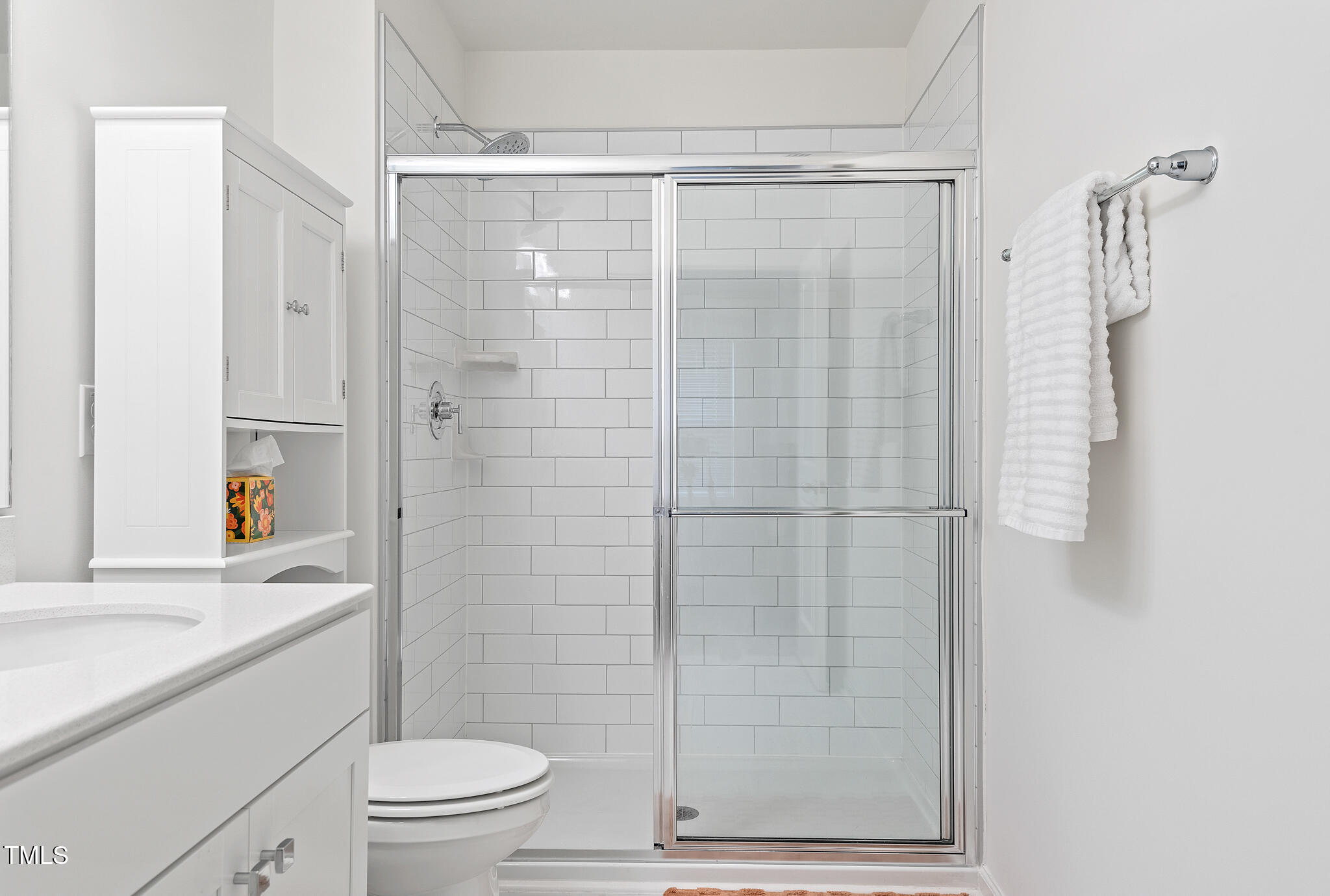 3028 Spline Circle Raleigh, NC 27610 - Photo 16 of 27 a bathroom with a shower a toilet and sink
