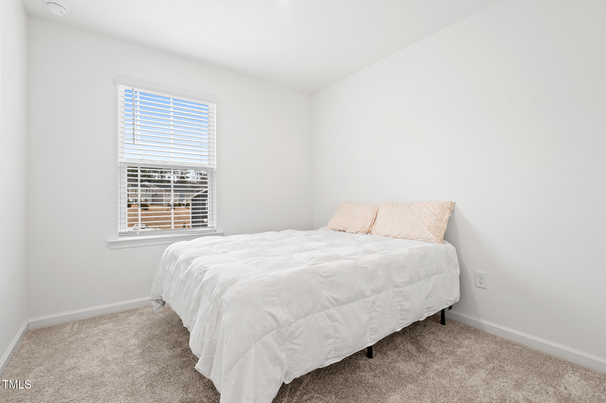 3028 Spline Circle Raleigh, NC 27610 - Photo 19 of 27 a bedroom with a bed and a window