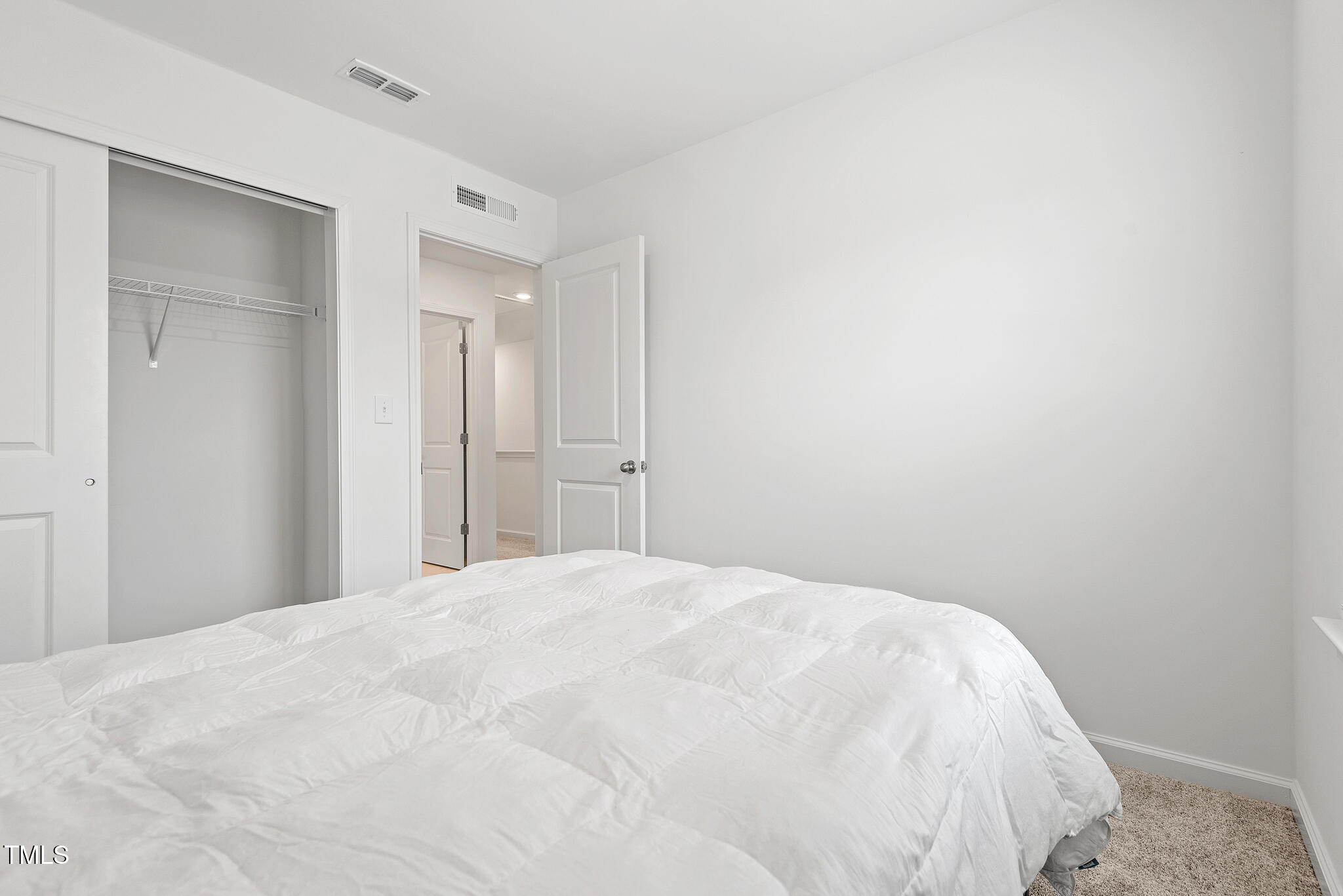 3028 Spline Circle Raleigh, NC 27610 - Photo 20 of 27 a large white bed in a white room