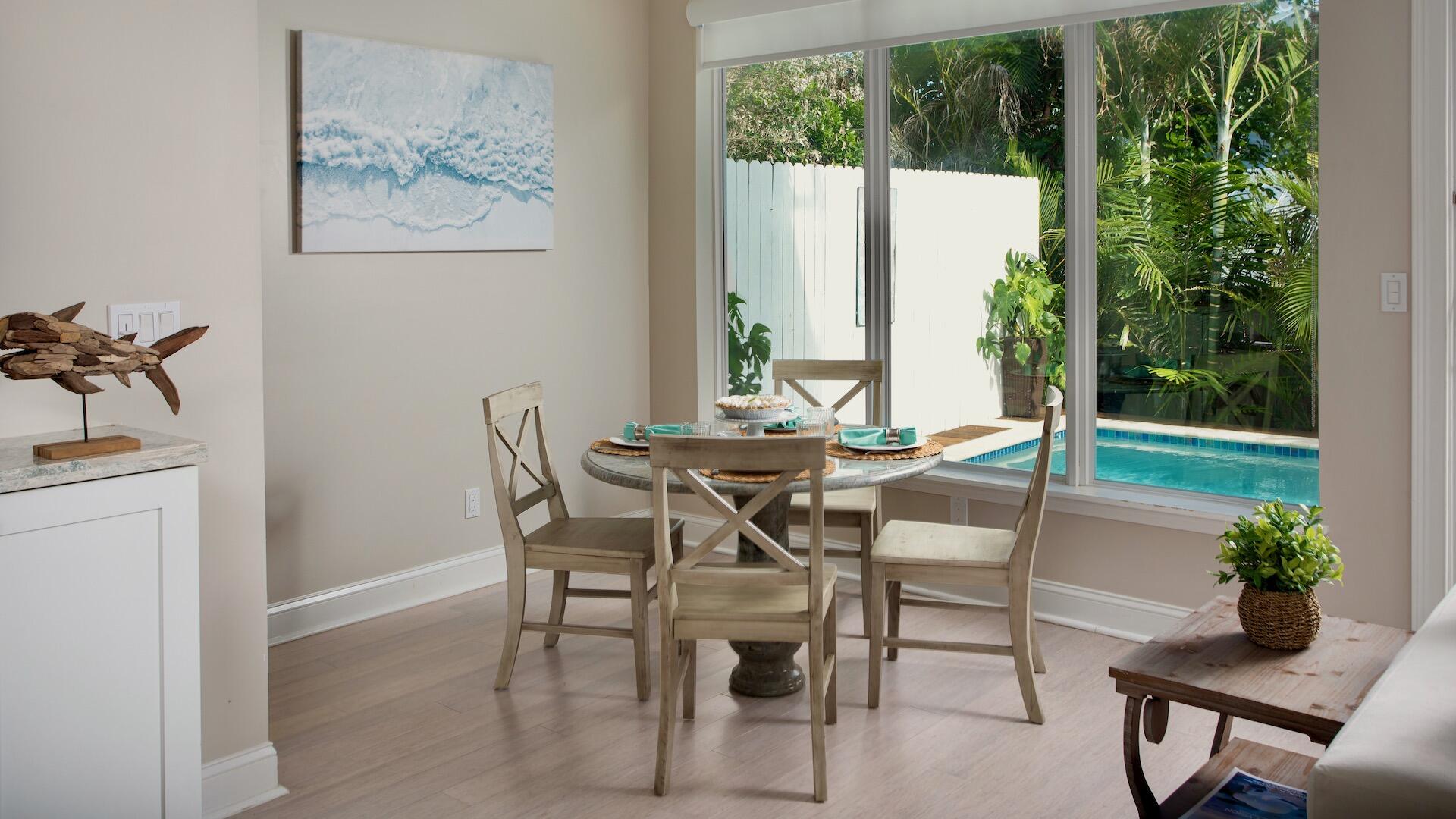 1327 Whitehead Street Key West, FL 33040 - Photo 13 of 37 a view of a dining room with furniture window and outside view
