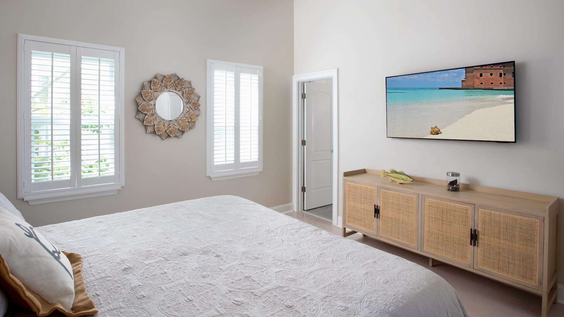 1327 Whitehead Street Key West, FL 33040 - Photo 21 of 37 a bedroom with windows and cabinet