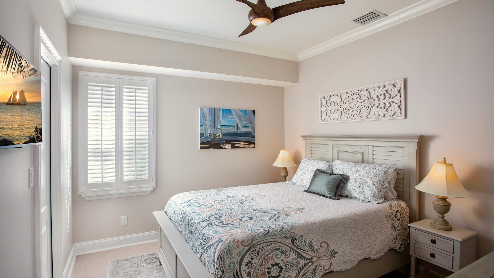 1327 Whitehead Street Key West, FL 33040 - Photo 32 of 37 a bedroom with a large bed and a tv