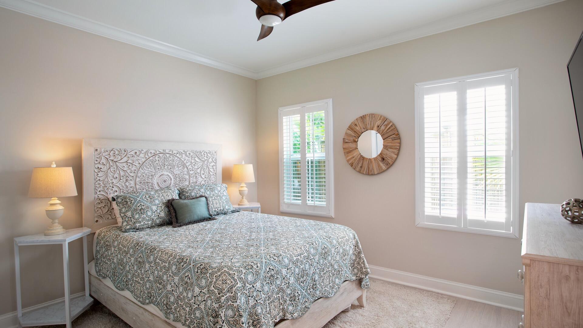1327 Whitehead Street Key West, FL 33040 - Photo 34 of 37 a bedroom with a large bed and windows