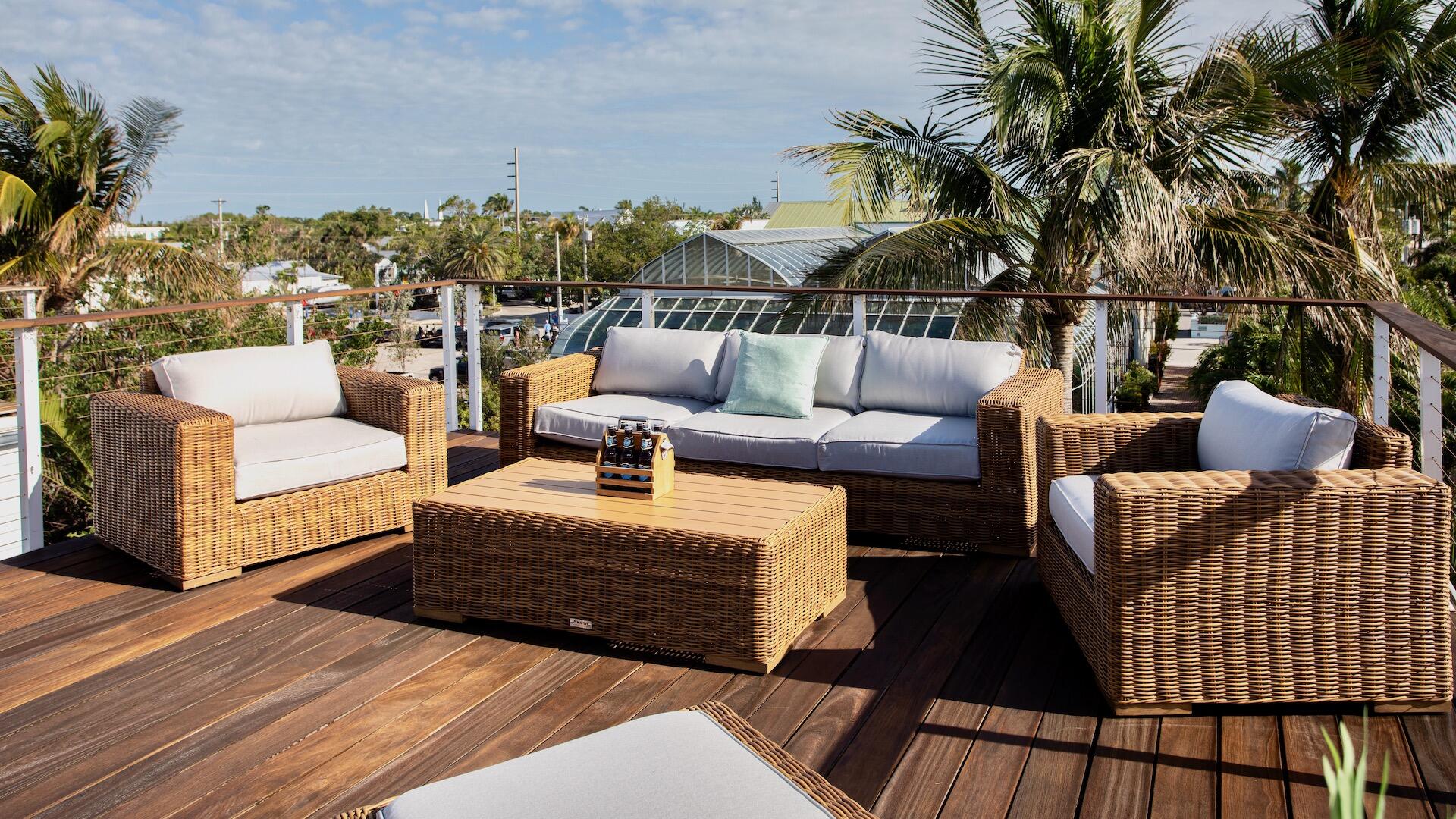 1327 Whitehead Street Key West, FL 33040 - Photo 9 of 37 a balcony with furniture and a potted plant