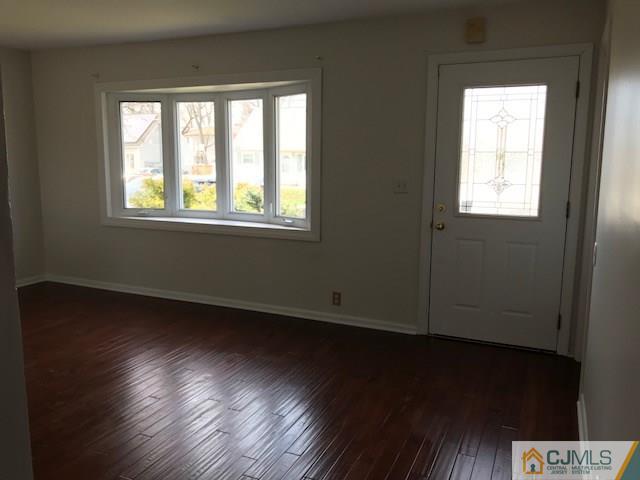 21 Kendall Road East Brunswick, NJ 08816 - Photo 2 of 21 a view of an empty room with wooden floor and a window