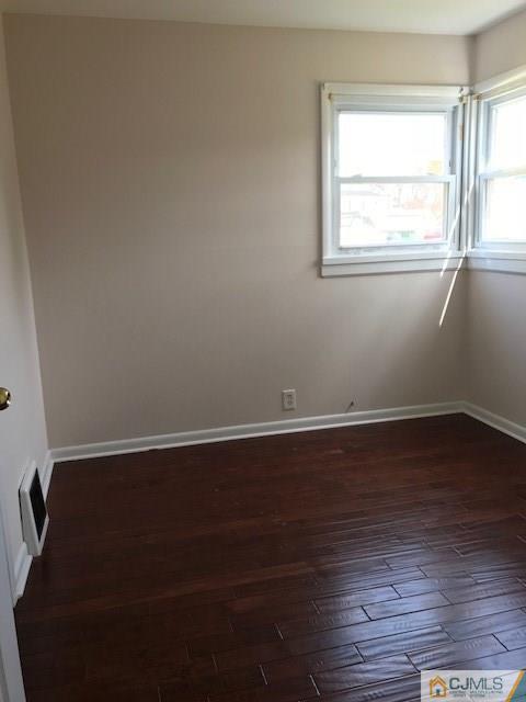 21 Kendall Road East Brunswick, NJ 08816 - Photo 11 of 21 an empty room with wooden floor and windows