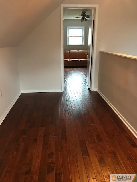 21 Kendall Road East Brunswick, NJ 08816 - Photo 14 of 21 an empty room with wooden floor cabinet and windows