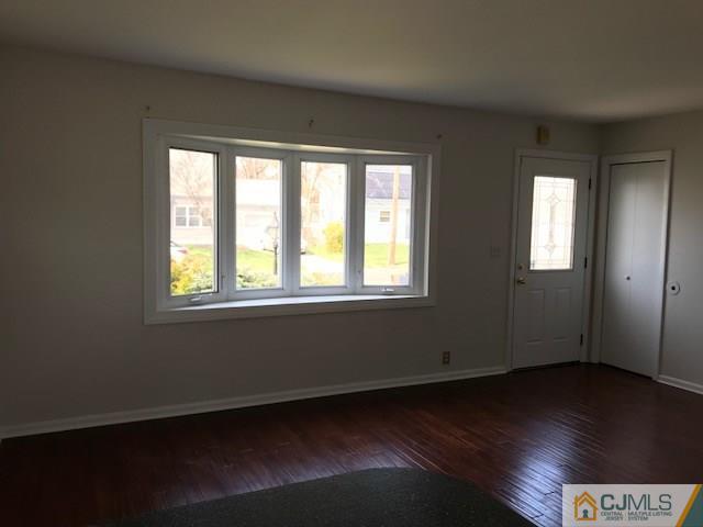 21 Kendall Road East Brunswick, NJ 08816 - Photo 5 of 21 a view of an empty room with wooden floor and a window