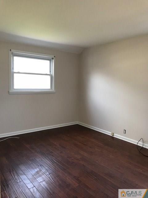 21 Kendall Road East Brunswick, NJ 08816 - Photo 10 of 21 an empty room with wooden floor and windows