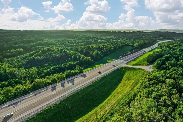 a view of a city from a balcony with yard