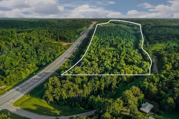 a balcony with lots of green space and plants