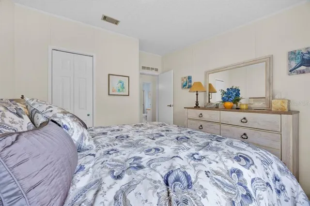 a bedroom with a bed and a dresser