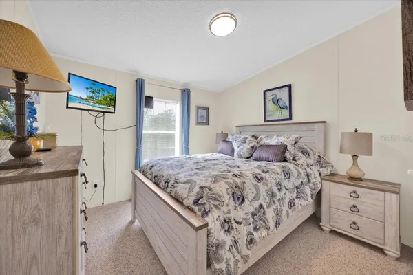 a bedroom with a bed and a dresser