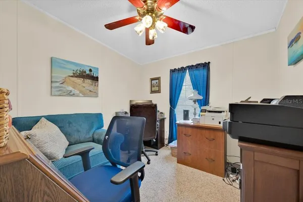 a living room with furniture and a window