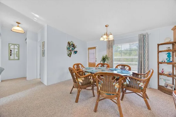 a dining room with furniture and window