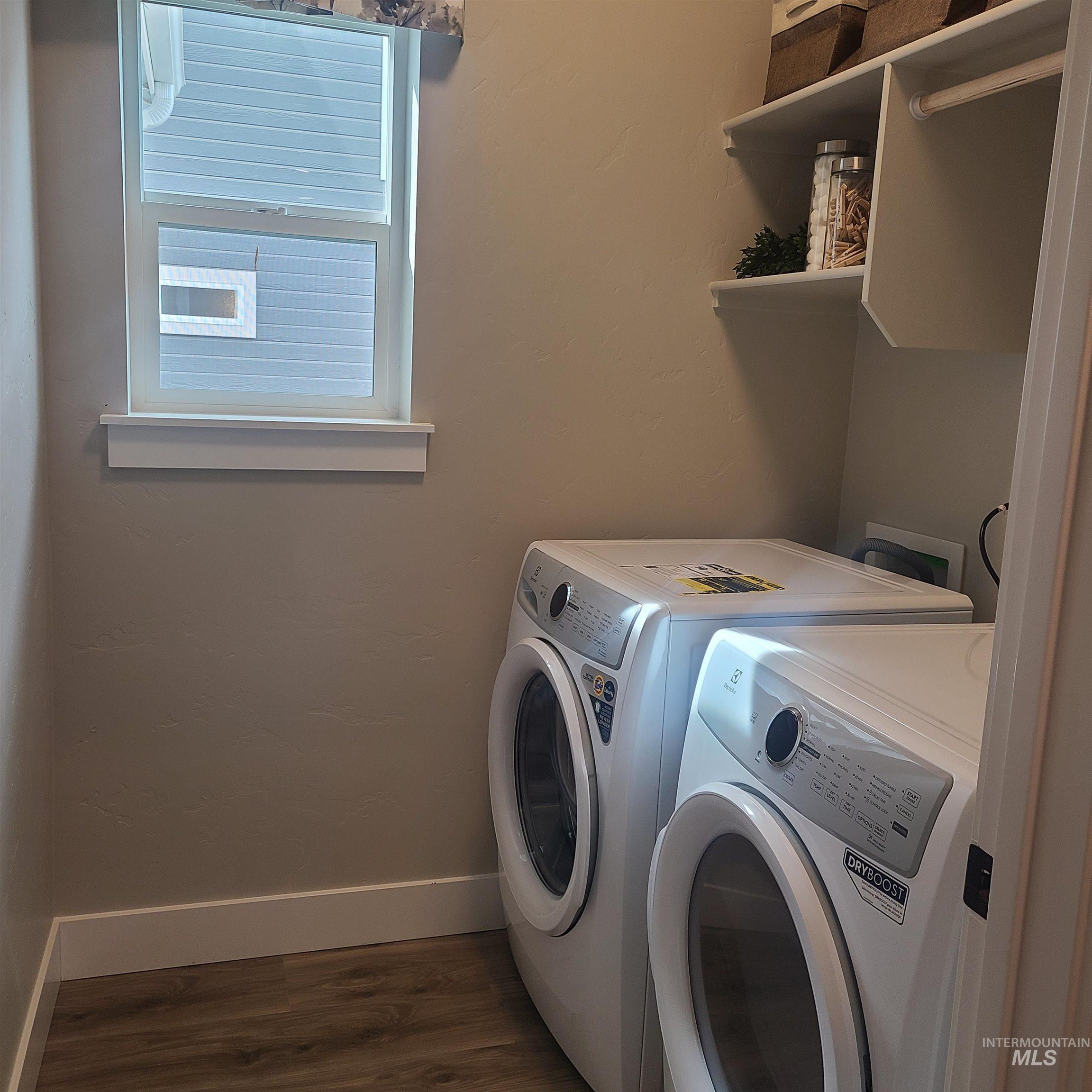 447 South Jake Avenue Kuna, ID 83634 - Photo 9 of 14 Laundry area with dark wood-type flooring and washing machine and clothes dryer