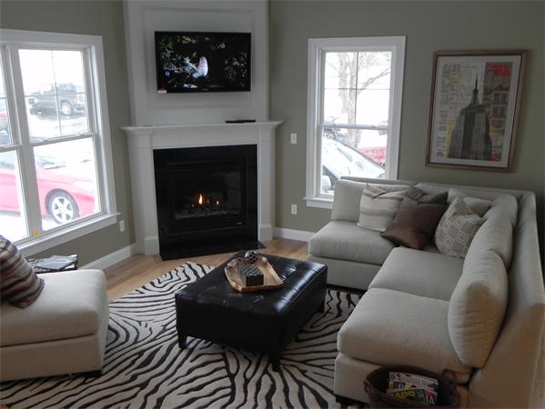 14 Union Street, Unit RIGHTSIDE Needham, MA 02494 - Photo 1 of 1 a living room with furniture a fireplace and window