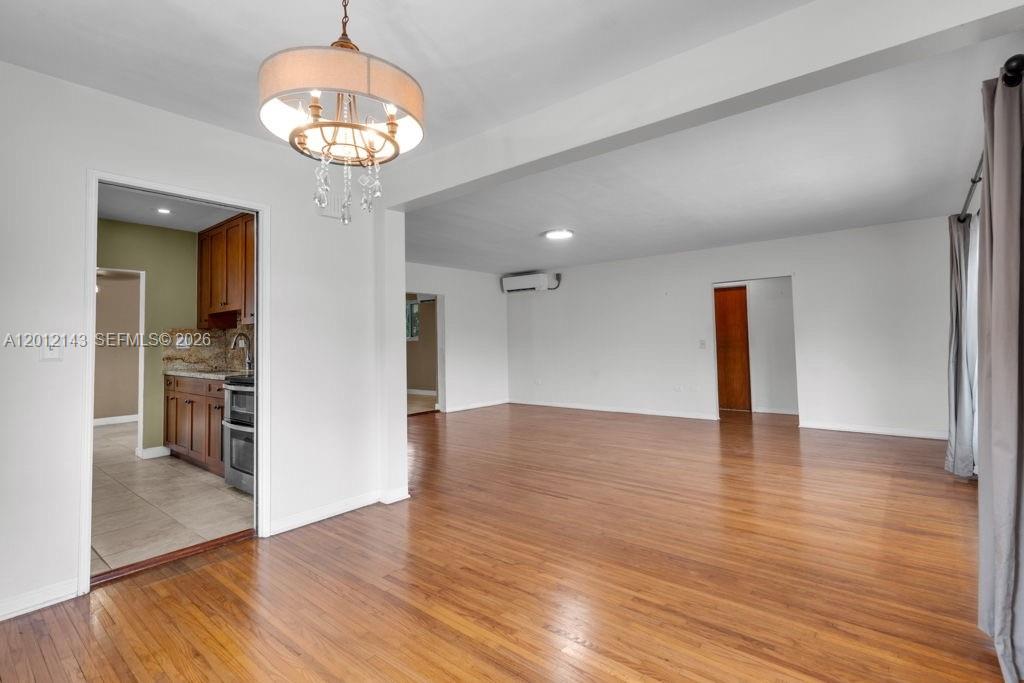 5651 Northwest 3rd Street Miami, FL 33126 - Photo 6 of 21 a view of a livingroom with wooden floor