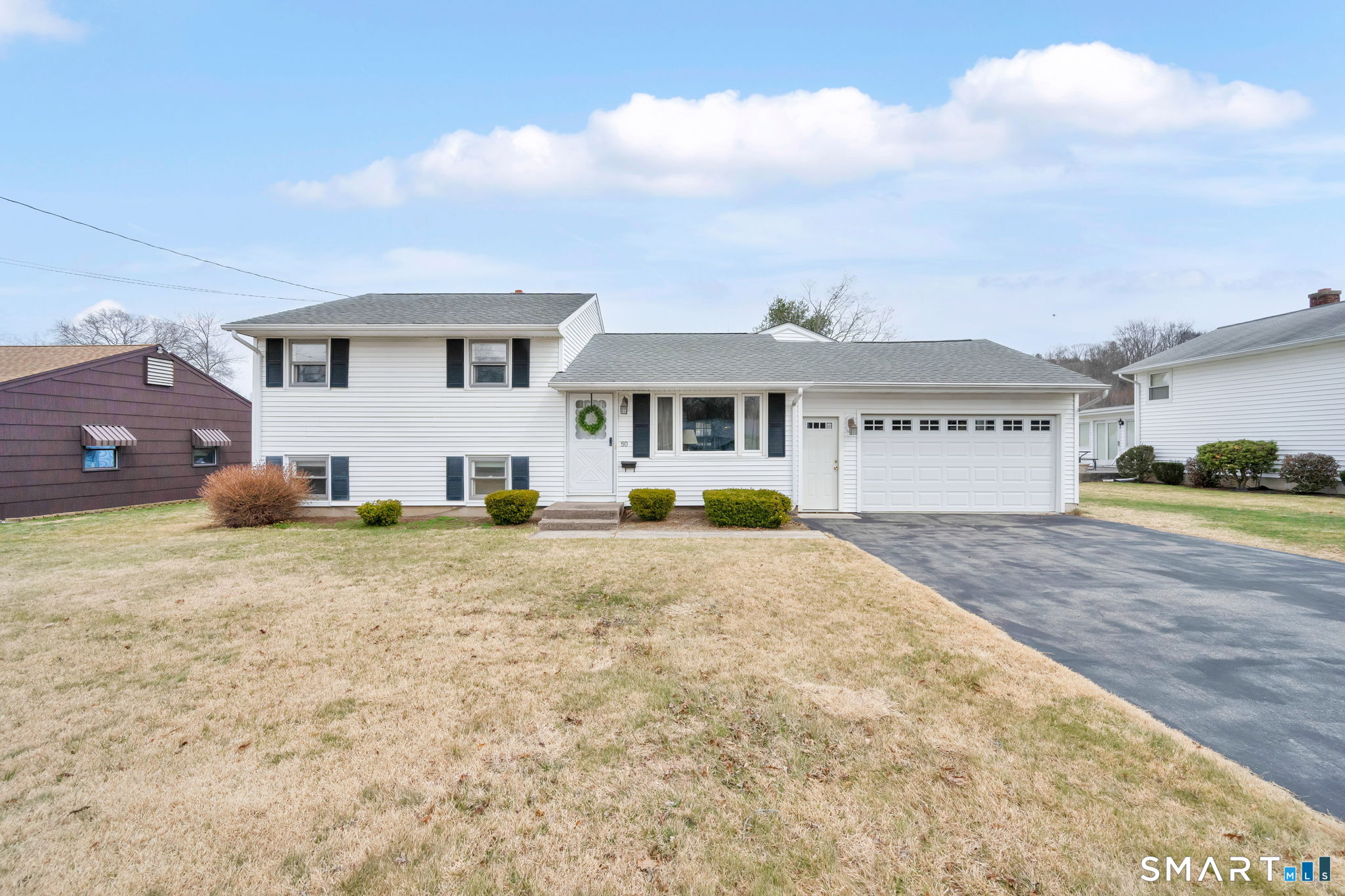 a front view of a house with a yard