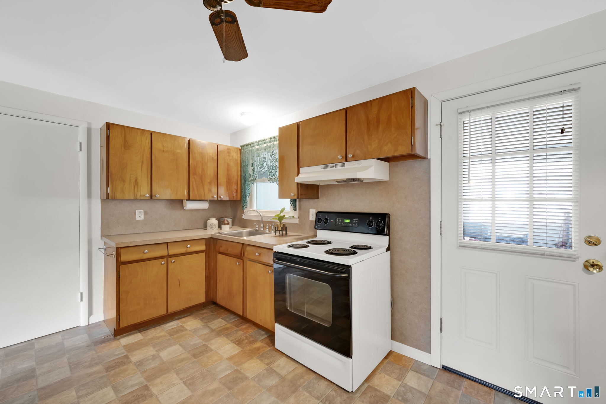 50 Carr Street Wallingford, CT 06492 - Photo 15 of 34 a kitchen with stainless steel appliances granite countertop a stove a sink and a microwave