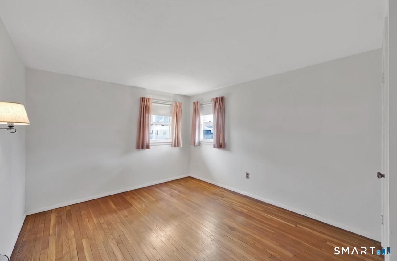 50 Carr Street Wallingford, CT 06492 - Photo 21 of 34 a view of empty room with wooden floor and fan