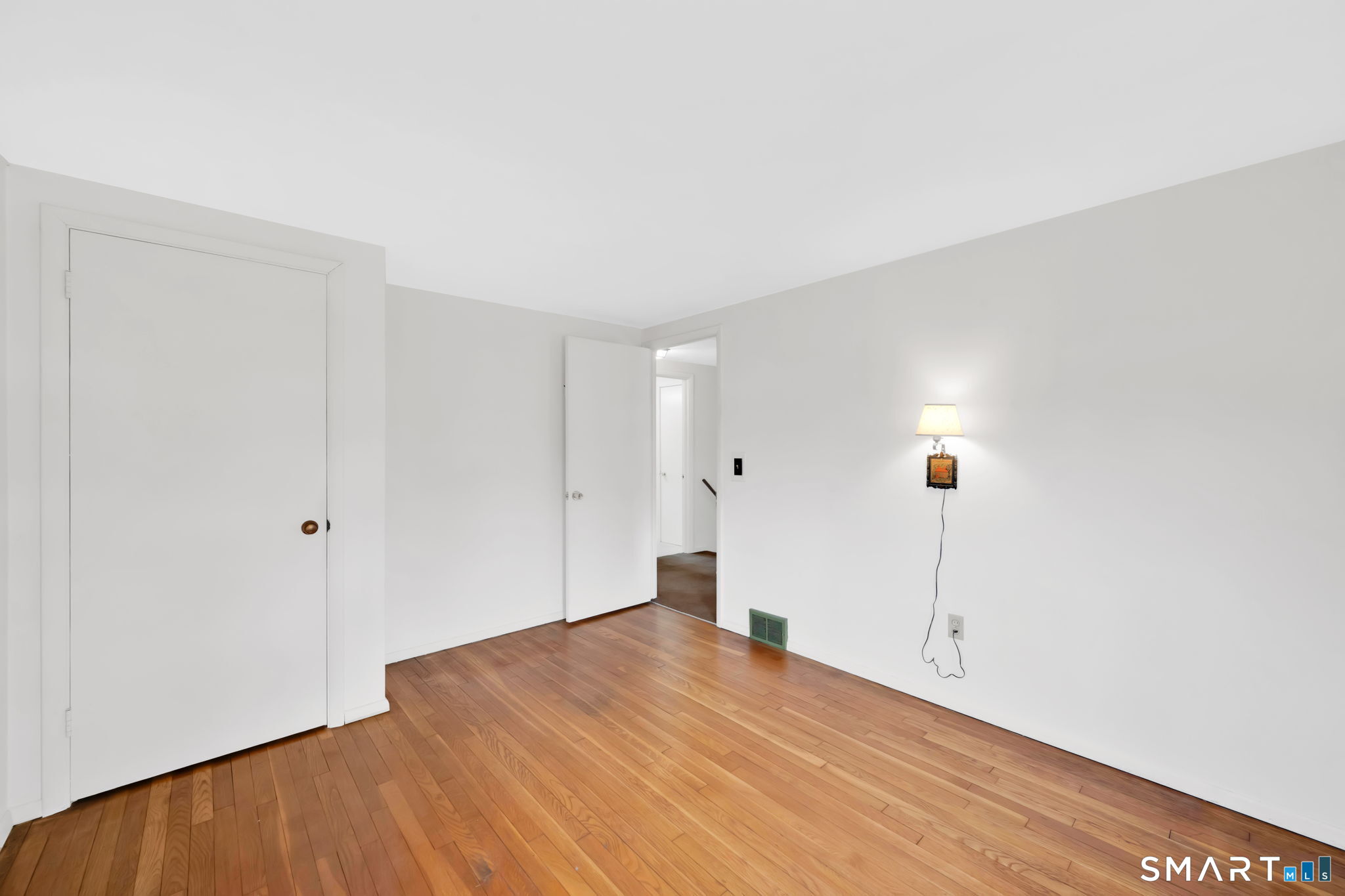 50 Carr Street Wallingford, CT 06492 - Photo 22 of 34 a view of empty room with wooden floor
