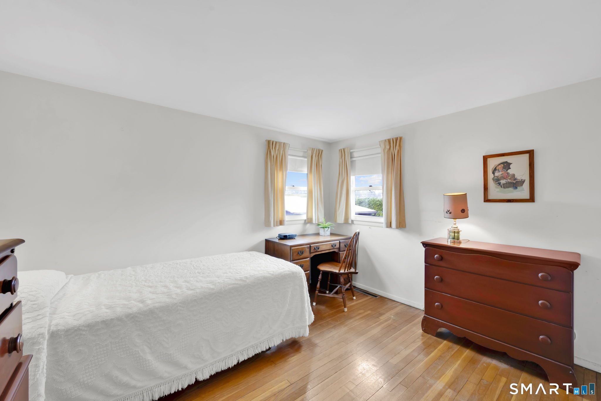 50 Carr Street Wallingford, CT 06492 - Photo 23 of 34 a bedroom with a bed and a table