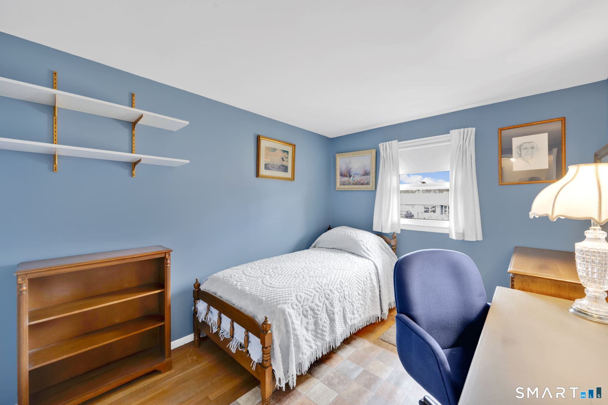 50 Carr Street Wallingford, CT 06492 - Photo 25 of 34 a bedroom with a bed and wooden floor