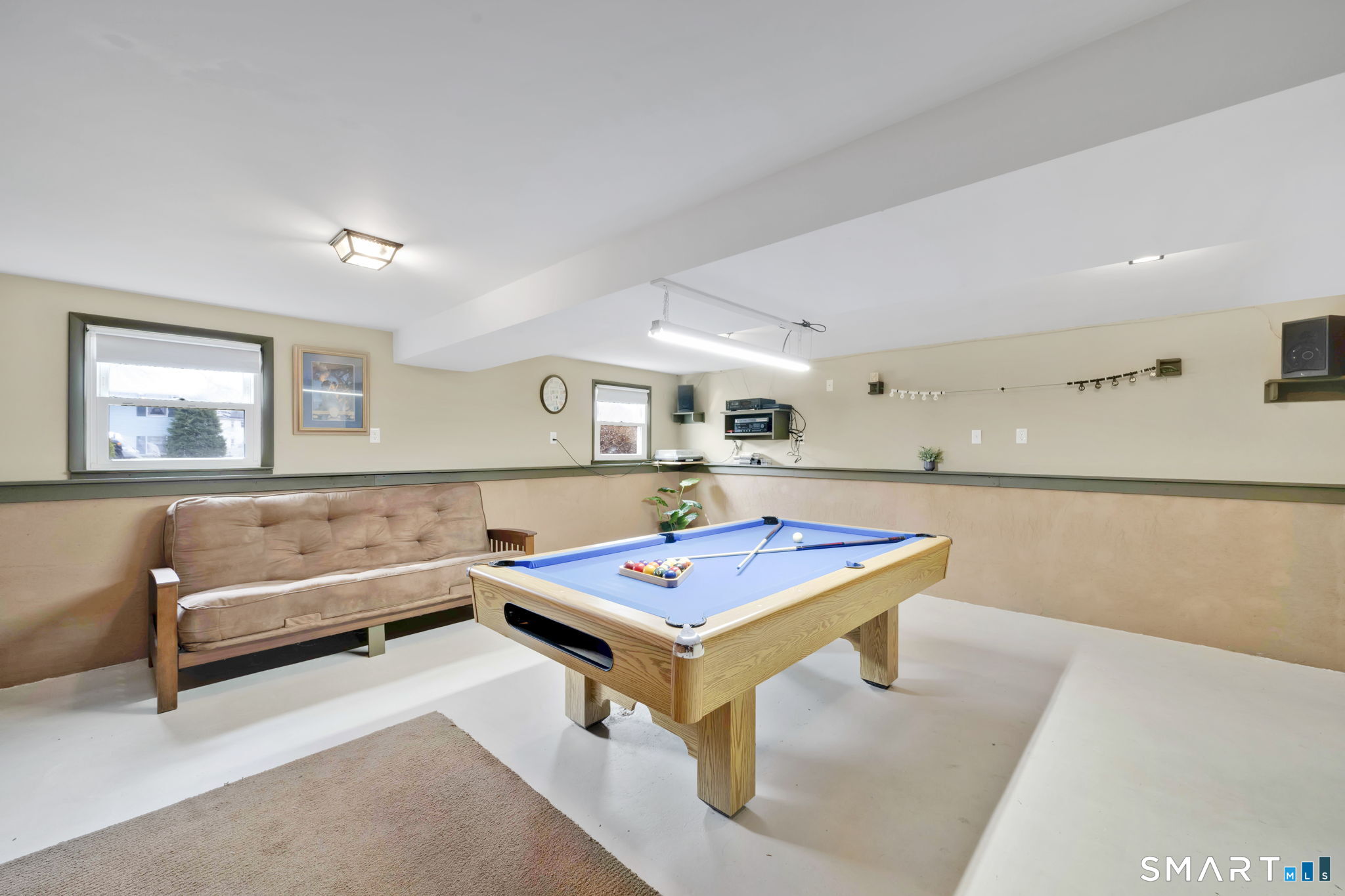 50 Carr Street Wallingford, CT 06492 - Photo 28 of 34 a living room with furniture pool table and wall paintings