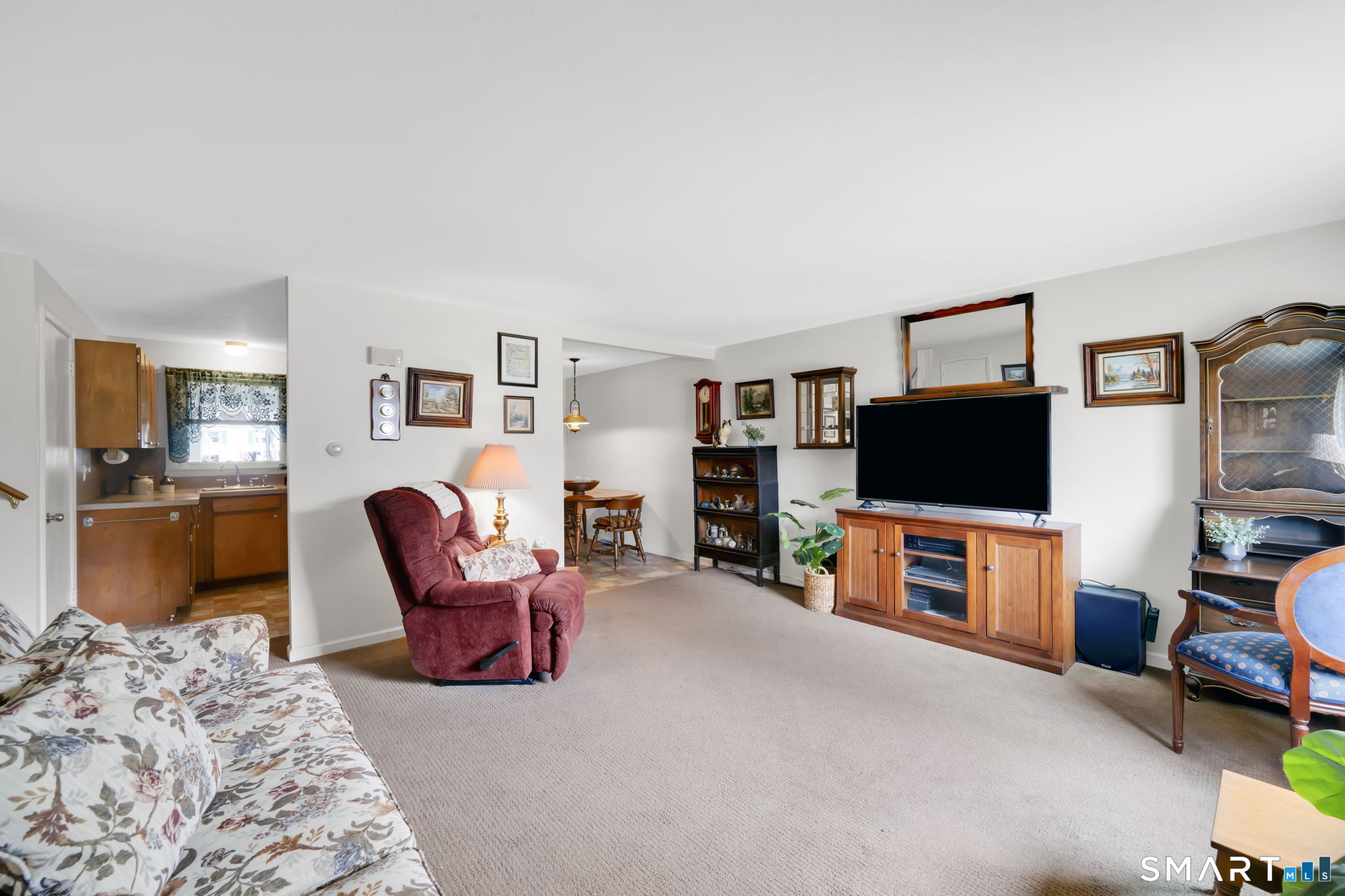 50 Carr Street Wallingford, CT 06492 - Photo 9 of 34 a living room with furniture and a flat screen tv