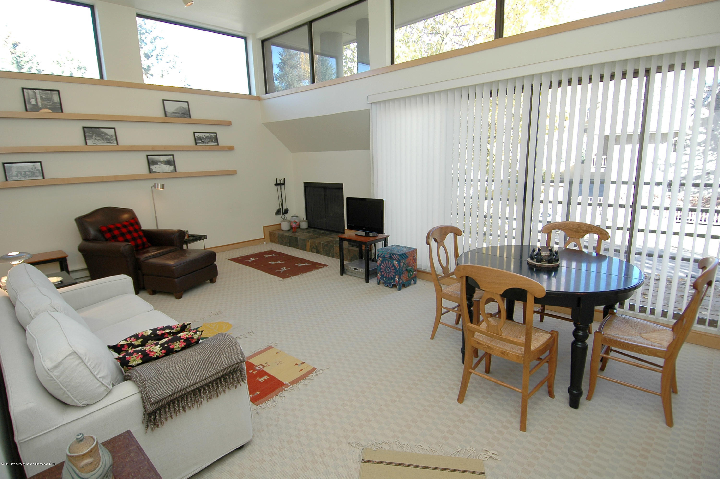 311 South Aspen Street, Unit 6 Aspen, CO 81611 - Photo 1 of 12 a room with furniture and a window