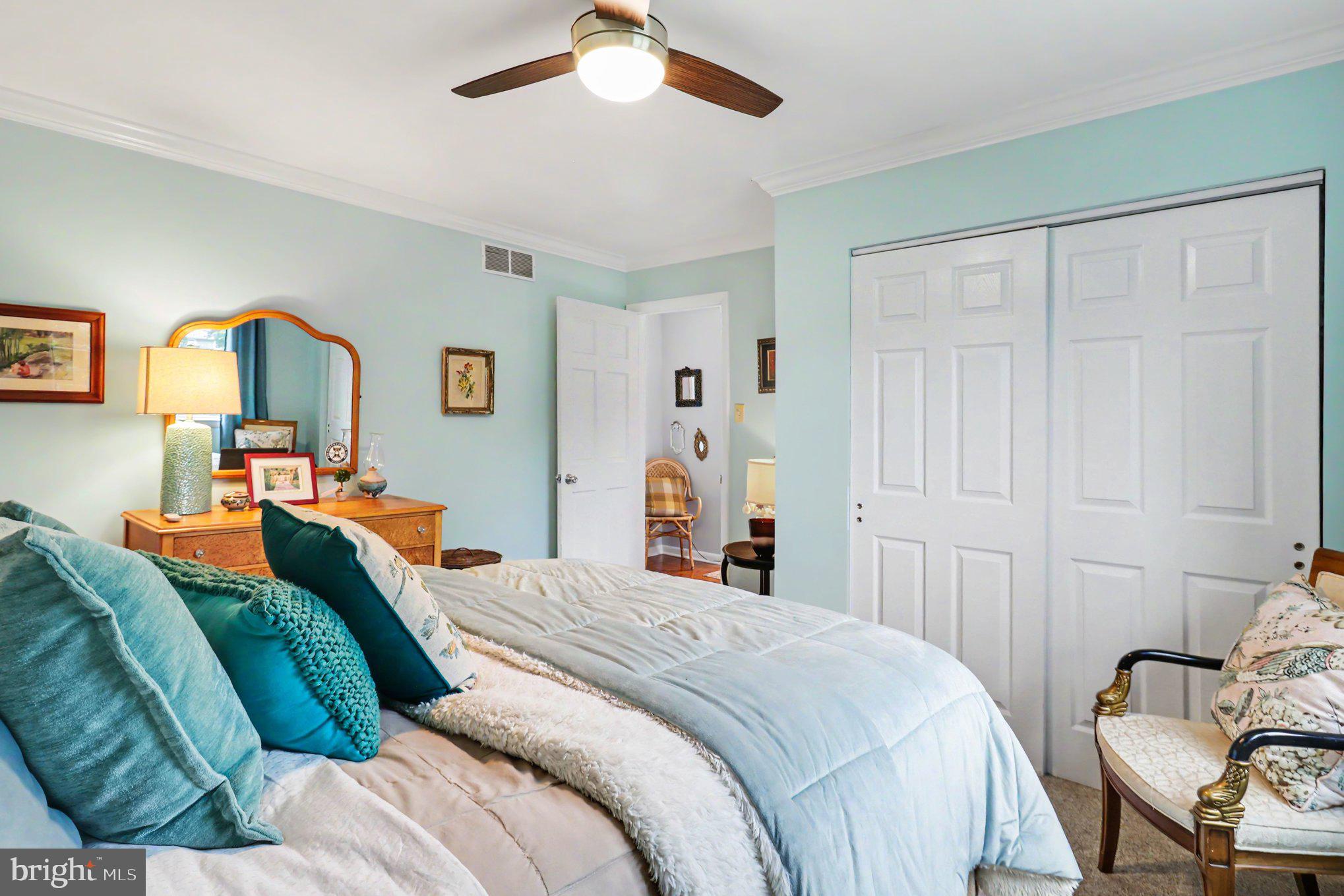 25 East Knowlton Road Media, PA 19063 - Photo 42 of 73 a bedroom with a bed and a chandelier