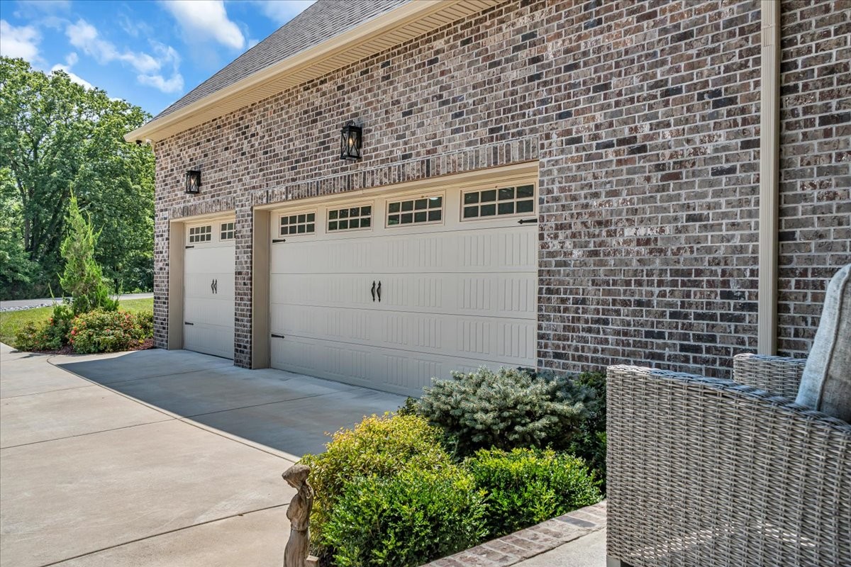 667 Rutherford Lane Smithville, TN 37166 - Photo 12 of 89 a front view of a house with a garage