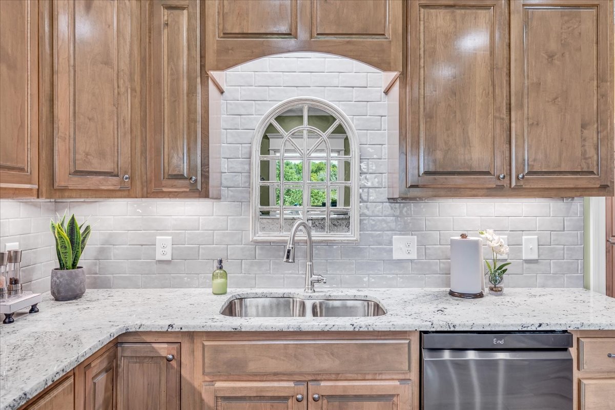 667 Rutherford Lane Smithville, TN 37166 - Photo 32 of 89 a kitchen with stainless steel appliances granite countertop a sink a stove and cabinets