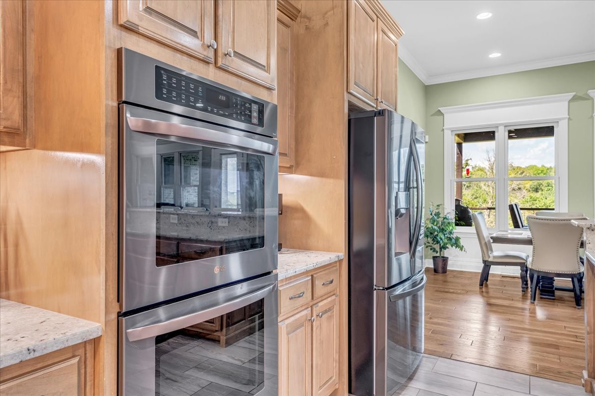 667 Rutherford Lane Smithville, TN 37166 - Photo 35 of 89 a kitchen with stainless steel appliances granite countertop a refrigerator and a stove