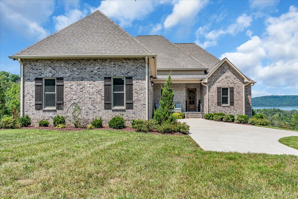 667 Rutherford Lane Smithville, TN 37166 - Photo 4 of 89 a front view of a house with a yard