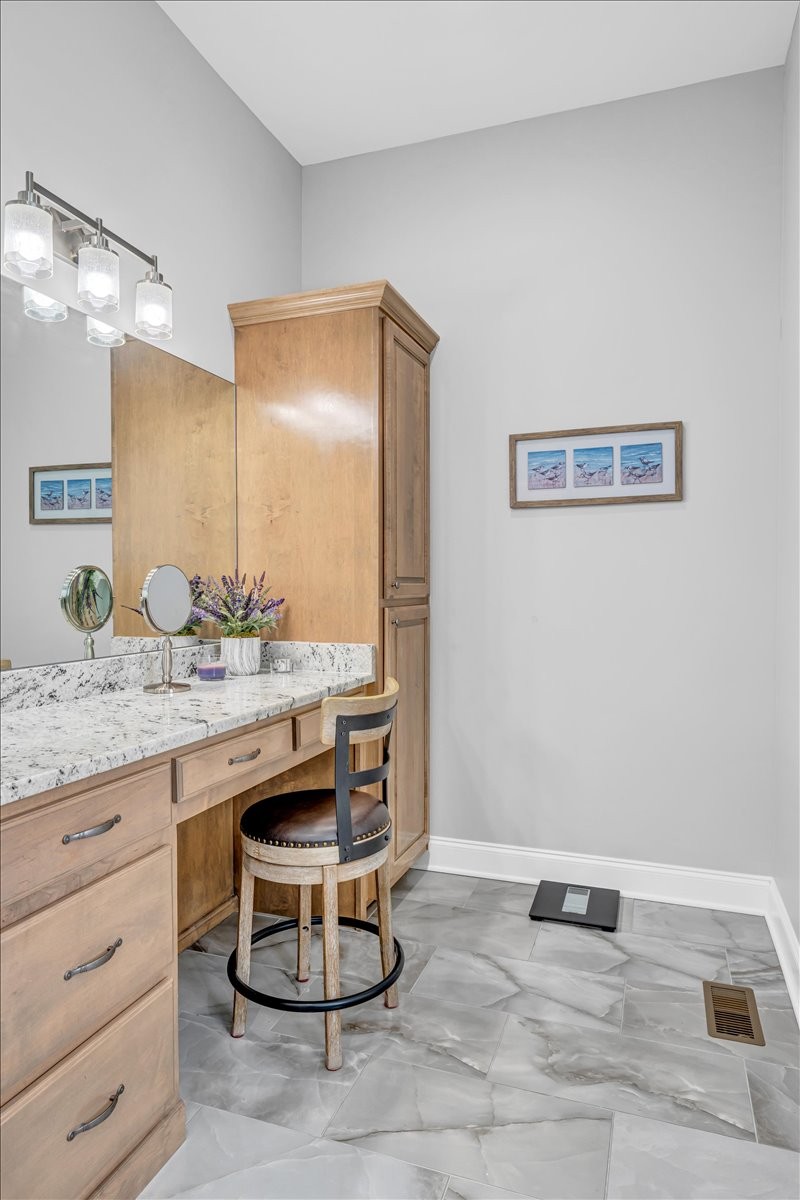 667 Rutherford Lane Smithville, TN 37166 - Photo 46 of 89 a bathroom with a granite countertop sink and a mirror