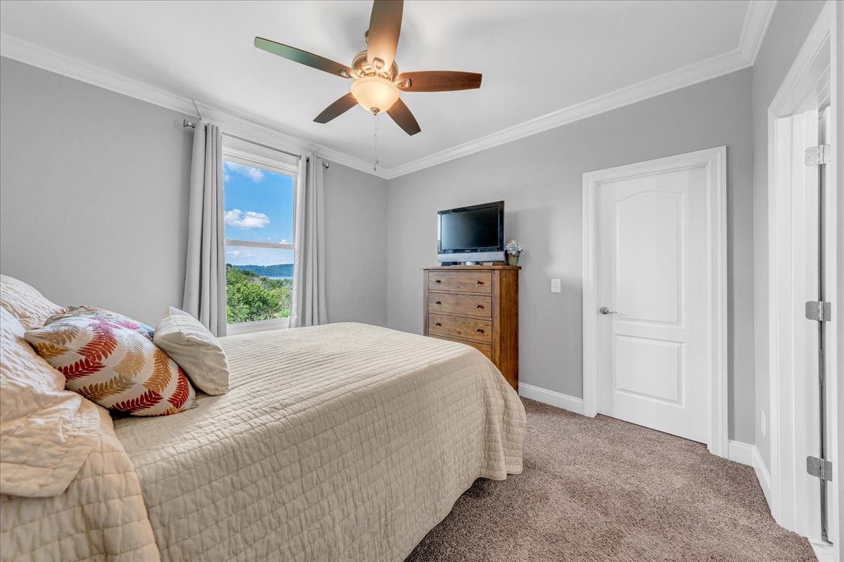 667 Rutherford Lane Smithville, TN 37166 - Photo 52 of 89 a bedroom with a bed and a tv