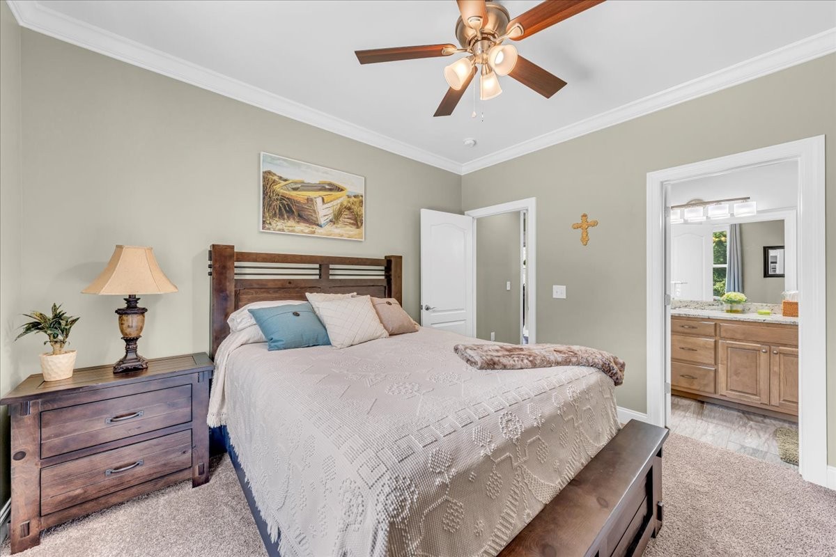 667 Rutherford Lane Smithville, TN 37166 - Photo 59 of 89 a bedroom with a bed and a chandelier